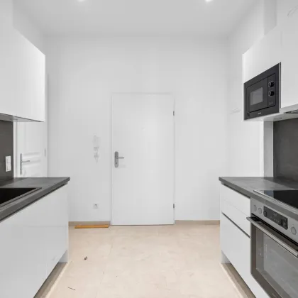 Erstbezug | Sanierter Altbau | 13m² Süd-Balkon | 3 Minuten zur U3 |  Hochwertige Küche - Bild 3