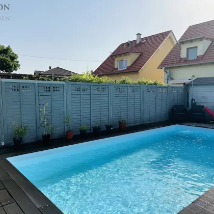 Exklusive Wohnidylle: Einfamilienhaus in Breitenlee mit großem Garten, Terrasse und Schwimmbecken - Bild 3