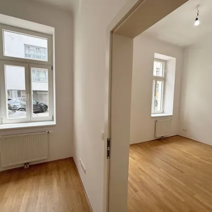 ERDGESCHOSS Wohnung mit Terrasse + Eigengarten in schönem ALTBAU 1100 Wien - Bild 2